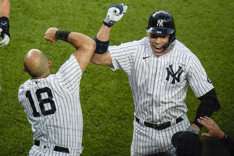 New York Yankees' Aaron Judge, right, celebrates with teammate Rougned Odor after hiting a two-run home run during the fourth inning of the second game of a baseball doubleheader Thursday, May 27, 2021, in New York. (AP Photo/Frank Franklin II)