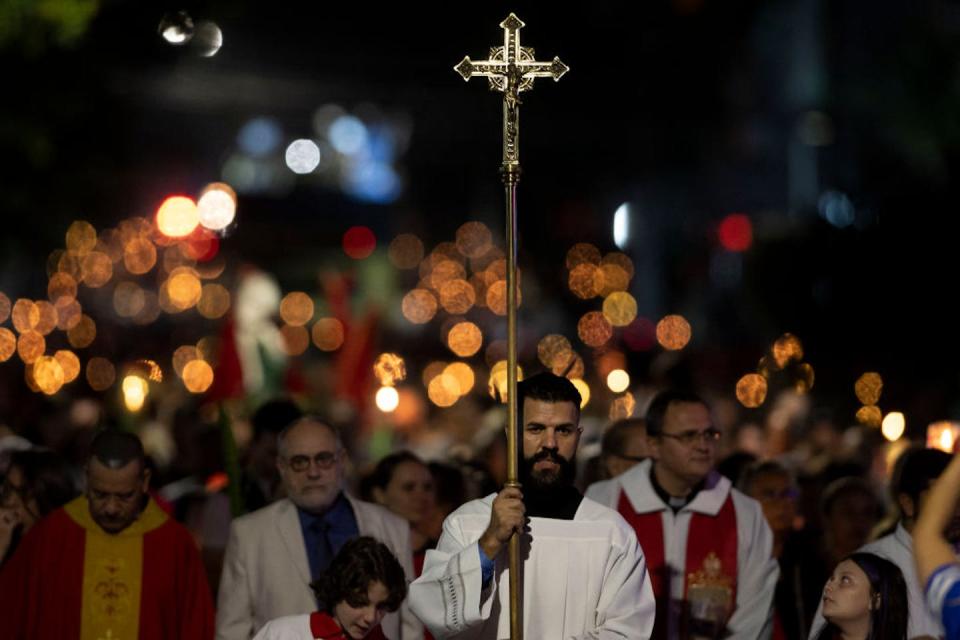 A Catholic procession in Porto Alegre, Brazil, on April 22, 2023. <a href="https://www.gettyimages.com/detail/news-photo/faithfuls-take-part-in-the-saint-george-procession-in-porto-news-photo/1252095526?adppopup=true" rel="nofollow noopener" target="_blank" data-ylk="slk:Silvio Avila/AFP via Getty Images;elm:context_link;itc:0;sec:content-canvas" class="link ">Silvio Avila/AFP via Getty Images</a>