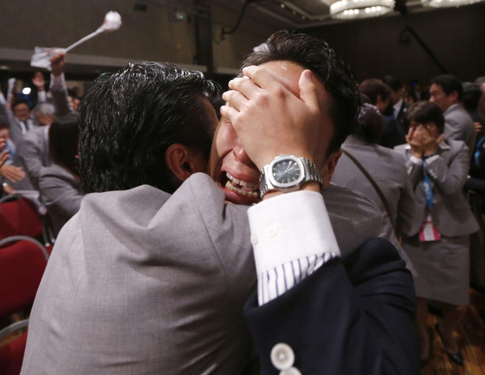 Japanese fencer Yuki Ota cries as Jacques Rogge President of the International Olympic Committee announces Tokyo as the city to host the 2020 Summer Olympic Game during a ceremony in Buenos Aires