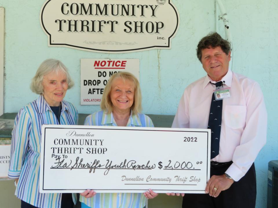 Dunnellon Community Thrift Shop volunteers Valerie Schaem and Leslie Roy (left to right) are pictured presenting a $2,000 check to Dennis Kellenberger, donation relations officer for the Florida Sheriffs Youth Ranches, Inc.