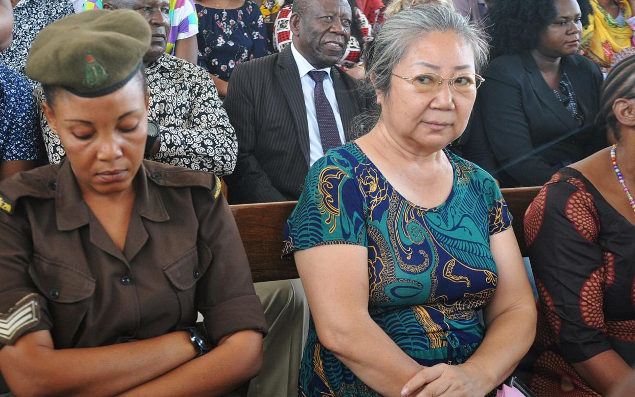 Yang Fenlan, known as the 'Ivory Queen', sits in Kisutu Resident Magistrate's Court - REUTERS