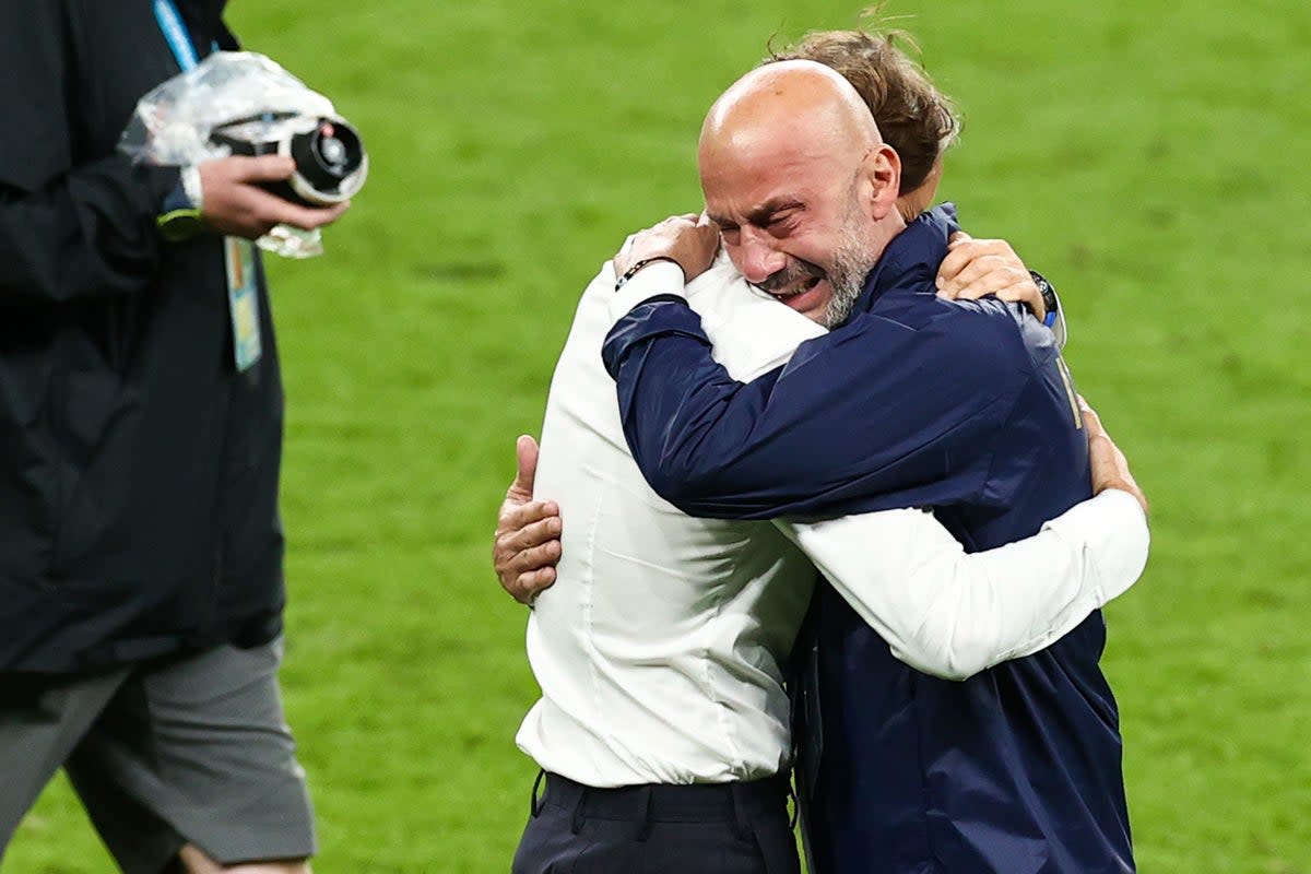 Italy manager Roberto Mancini (left) and Gianluca Vialli embrace on the pitch following their Euro 2024 win over England. (Christian Charisius/PA Media) (PA Media)