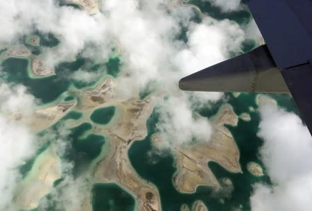 FILE PHOTO: Lagoons can be seen from a plane as it flies above Kiritimati Island, part of the Pacific Island nation of Kiribati