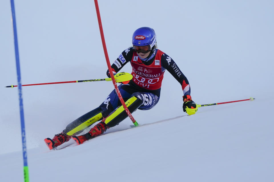 United States' Mikaela Shiffrin speeds down the course during the first run of an alpine ski World Cup women's slalom race, in Levi, Finland, Saturday, Nov. 11, 2023. (AP Photo/Giovanni Auletta)