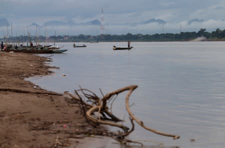 Fishermen fish in the Mekong River in Nakhon Phanom