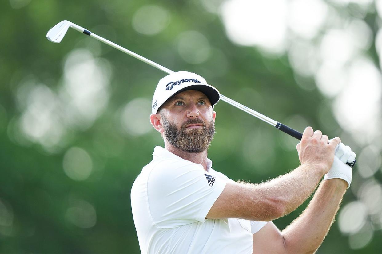 Dustin Johnson hits his shot from the 14th tee during the first round of the 2022 PGA Championship at the Southern Hills on May 19, 2022 in Tulsa, Oklahoma.