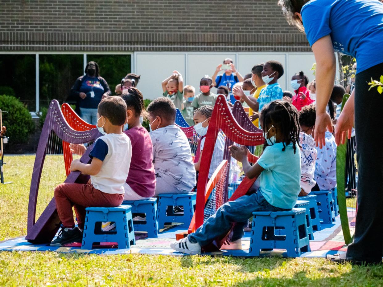 Students from Dorothy B. Johnson Pre-K perform on harps for their families and friends during a concert April 29, 2022 in Wilmington, NC. [PHOTO COURTESY OF BENJAMIN BRIER]