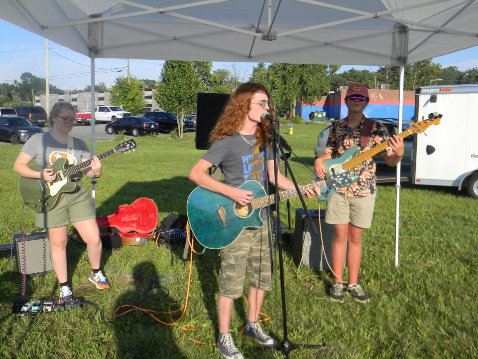 Electric Bluze, which includes Lila Satterfield, Lige Roberts and Summit Hetman, performs at the inaugural Oak Ridge Food Truck Rally.