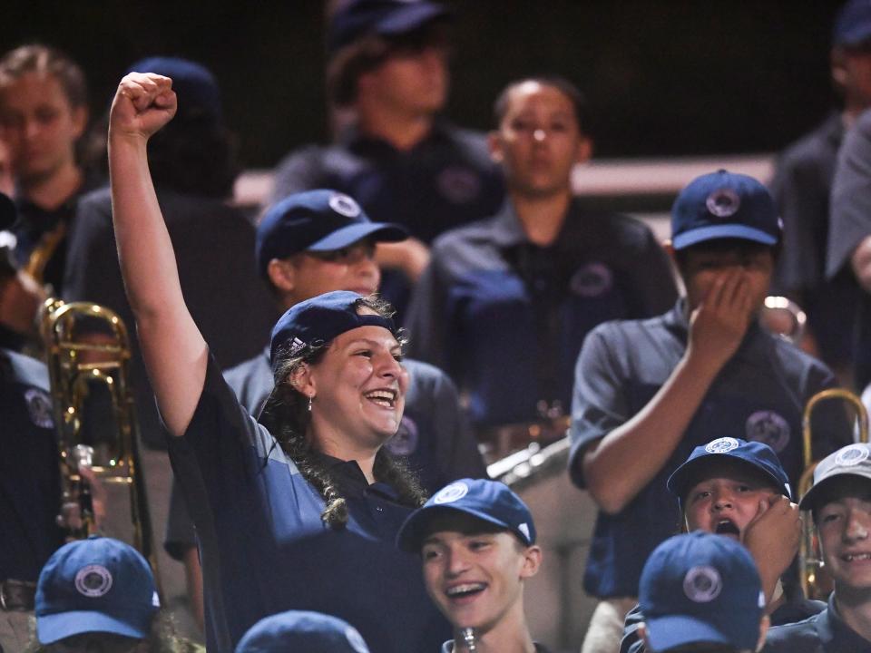 Spectators cheer on the Farragut High band Sept. 9 during the game at Oak Ridge.