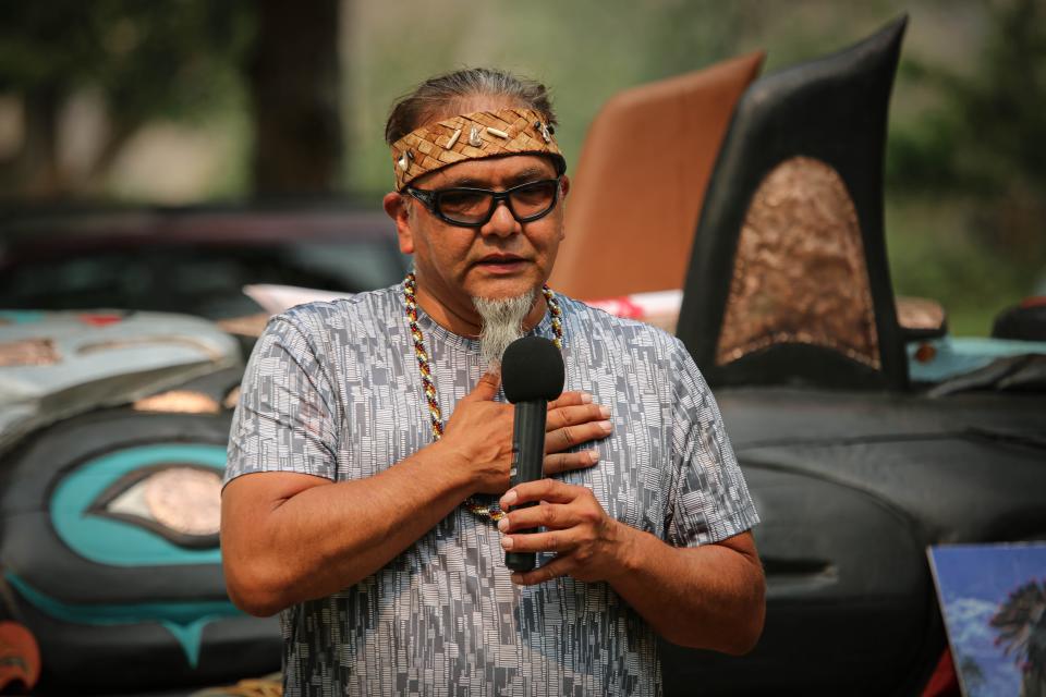 Lummi totem carver Phreddie Lane speaks on July 15 at the Snake River Canyon stop in Idaho of the Red Road to D.C. tour, which finds dozens of Native American activists driving cross-country with the 25-foot tall totem to highlight the needs to protect sacred places.