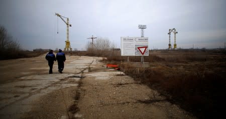 FILE PHOTO: Workers walk near the construction site of Bulgaria's second nuclear power plant in Belene