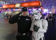 Visitors dressed as 'Star Wars' characters pose during the Gamescom 2012 fair in Cologne August 15, 2012.