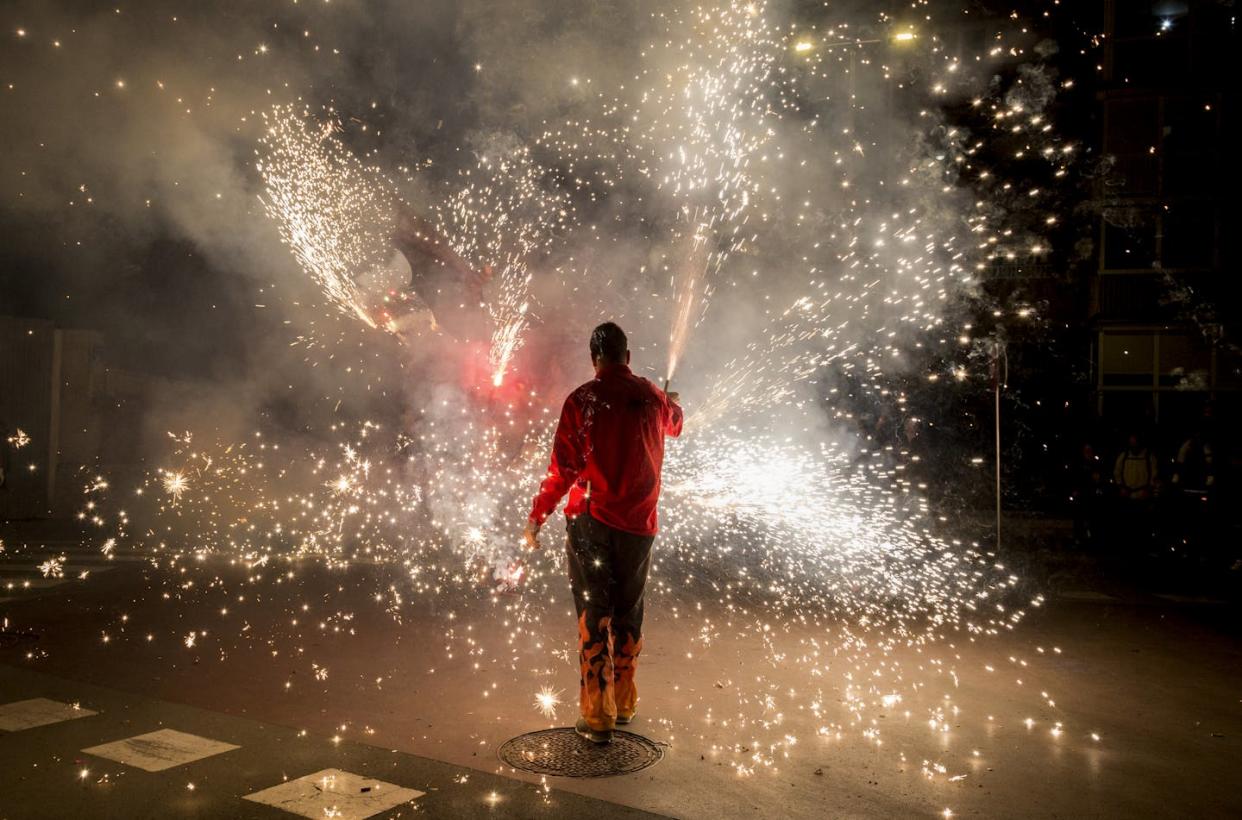 For those with PTSD, sounds from fireworks can trigger flashbacks. <a href="https://www.gettyimages.com/detail/photo/man-with-firework-display-standing-on-road-at-night-royalty-free-image/1146000103?adppopup=true" rel="nofollow noopener" target="_blank" data-ylk="slk:Getty Images / Josep Maria Gerardo / EyeEm;elm:context_link;itc:0;sec:content-canvas" class="link ">Getty Images / Josep Maria Gerardo / EyeEm </a>