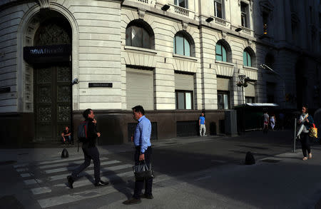 People are pictured outside a bank in Buenos Aires' financial district, Argentina October 18, 2018. Picture taken October 18, 2018. REUTERS/Marcos Brindicci