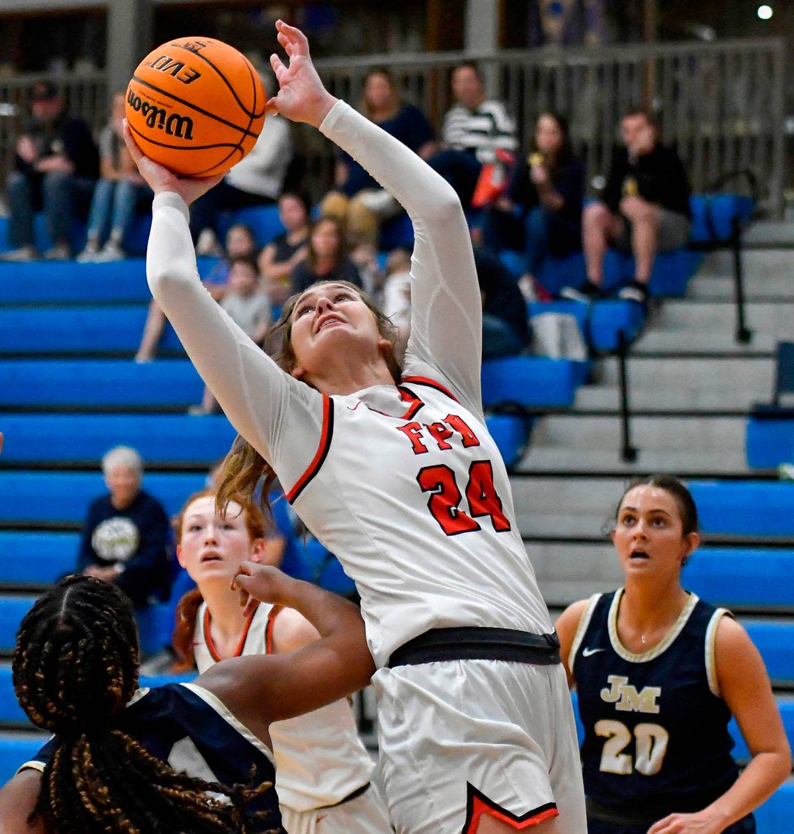 FPD’s Kendall Emener (24) puts up a shot over a John Milledge defender coach during the Vikings’ 57-47 loss in their region tournament Thursday.