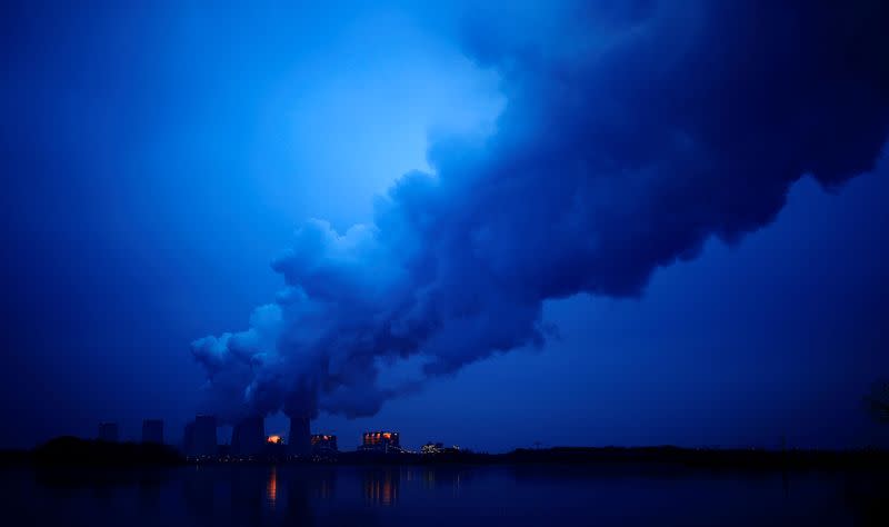 FILE PHOTO: Water vapour rises from the cooling towers of the Jaenschwalde lignite-fired power plant of Lausitz Energie Bergbau AG (LEAG) in Jaenschwalde