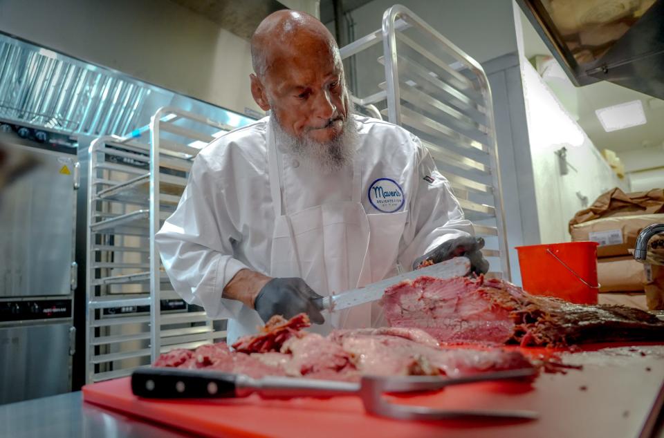 Meats are cut fresh in the kitchen at Maven's Delicatessen in Pawtucket.
