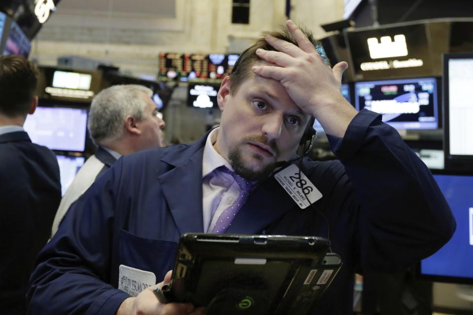 <p>Trader Michael Milano works on the floor of the New York Stock Exchange, May 10, 2017. U.S. stock indexes are mostly lower Wednesday morning following weak first-quarter reports from consumer-focused companies including Priceline and Disney. (Photo: Richard Drew/AP) </p>