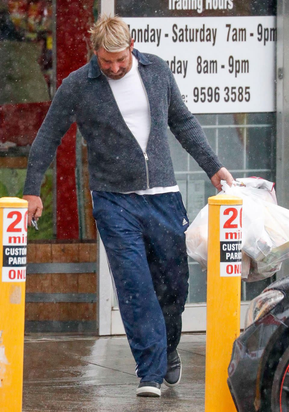 The father-of-three covered up in a grey sweater and navy tracksuit pants. Source: Media Mode