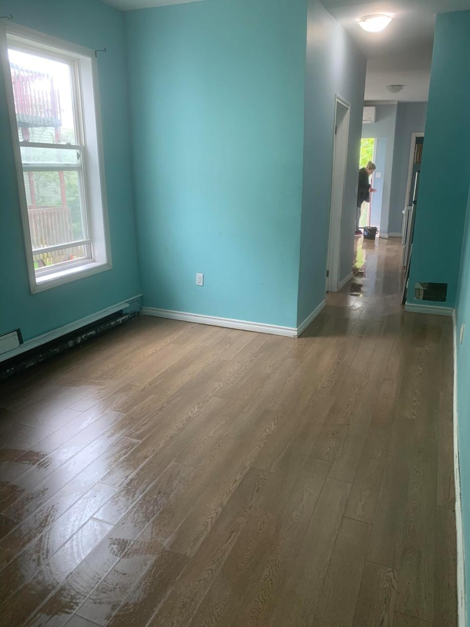 A member of the H.O.P.E. Team cleans an apartment after a client moves out.