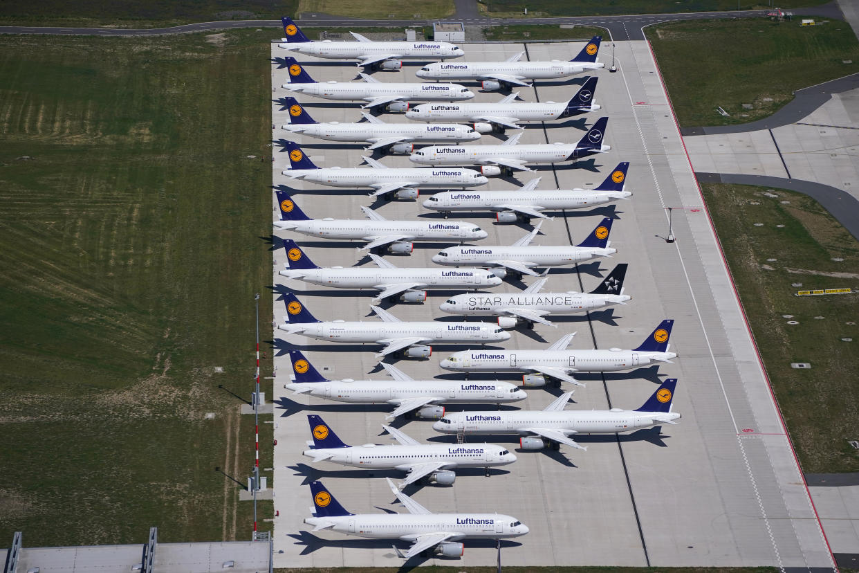 SCHOENEFELD, GERMANY - JUNE 01: Passenger planes of airline Lufthansa that have been temporarily pulled out of service stand parked at Berlin-Brandenburg Airport during the coronavirus crisis on June 01, 2020 in Schoenefeld, Germany. Countries across Europe are easing lockdown measures and many are seeking to promote a return of international travel and tourism. At the same time airlines are still facing a calamitous era, with some already receiving government bailouts and many announcing layoffs.   (Photo by Sean Gallup/Getty Images)