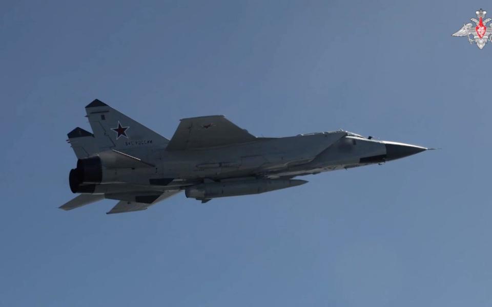 A Russian MiG-31 fighter jet equipped with a Kinzhal hypersonic missile flies during the second stage of tactical nuclear drills of the armed forces of Russia and Belarus