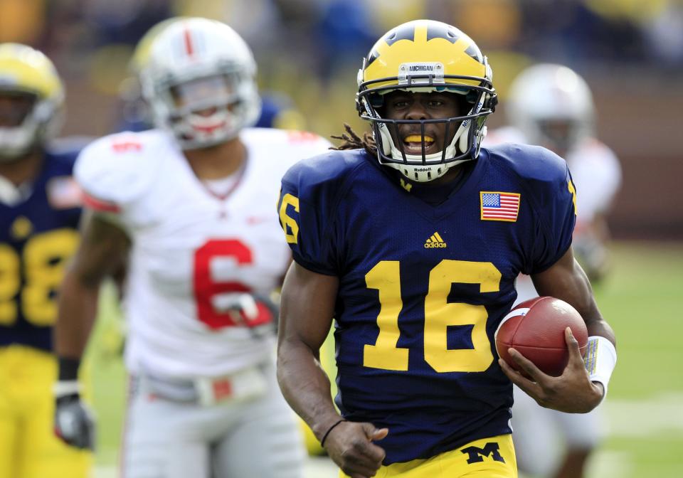 Michigan quarterback Denard Robinson runs for a 41-yard touchdown during the first quarter of the win over Ohio State on Saturday, Nov. 26, 2011, at Michigan Stadium.