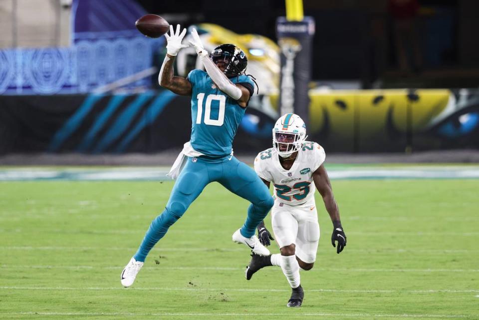Laviska Shenault Jr. #10 of the Jacksonville Jaguars catches a pass against Noah Igbinoghene #23 of the Miami Dolphins during the first quarter of a game on Sept. 24. (Photo by James Gilbert/Getty Images)