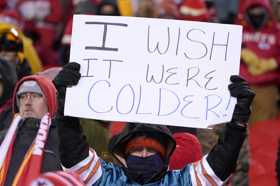 A fan holds up a sign before an NFL wild-card playoff football game between the Kansas City Chiefs and the Miami Dolphins on Saturday, Jan. 13, 2024, in Kansas City, Mo. (AP Photo/Ed Zurga)