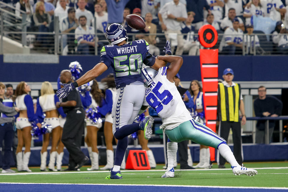 <p>Seattle Seahawks outside linebacker K.J. Wright (50) makes an interception on a pass intended for Dallas Cowboys wide receiver Noah Brown (85) during the NFC wildcard playoff game between the Seattle Seahawks and Dallas Cowboys on January 5, 2019 at AT&T Stadium in Arlington, TX. (Photo by Andrew Dieb/Icon Sportswire) </p>