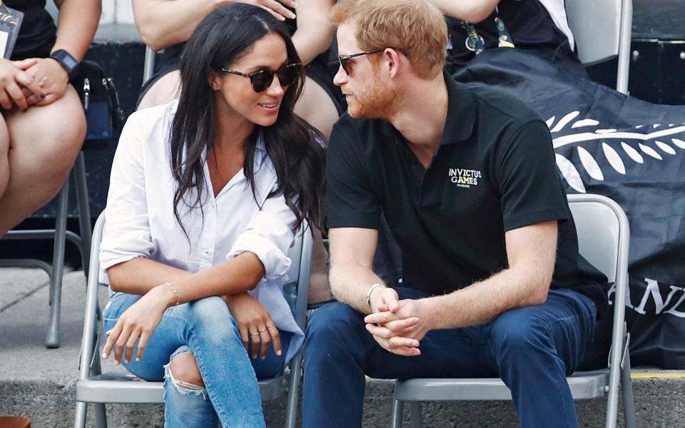 Meghan wearing Misha Nonoo's Husband shirt in Canada - Reuters