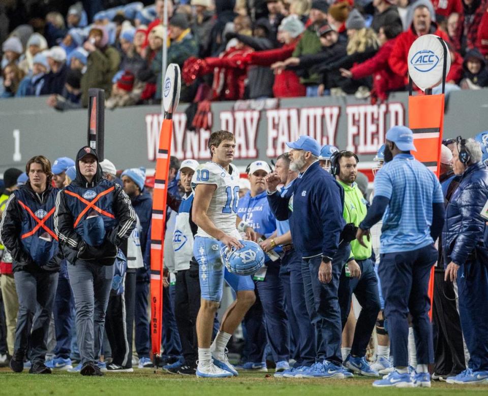 North Carolina quarterback Drake Maye (10) walks off the field early in the second quarter after having only three yards passing against N.C. State on Saturday, November 25, 2023 at Carter-Finley Stadium in Raleigh, N.C.