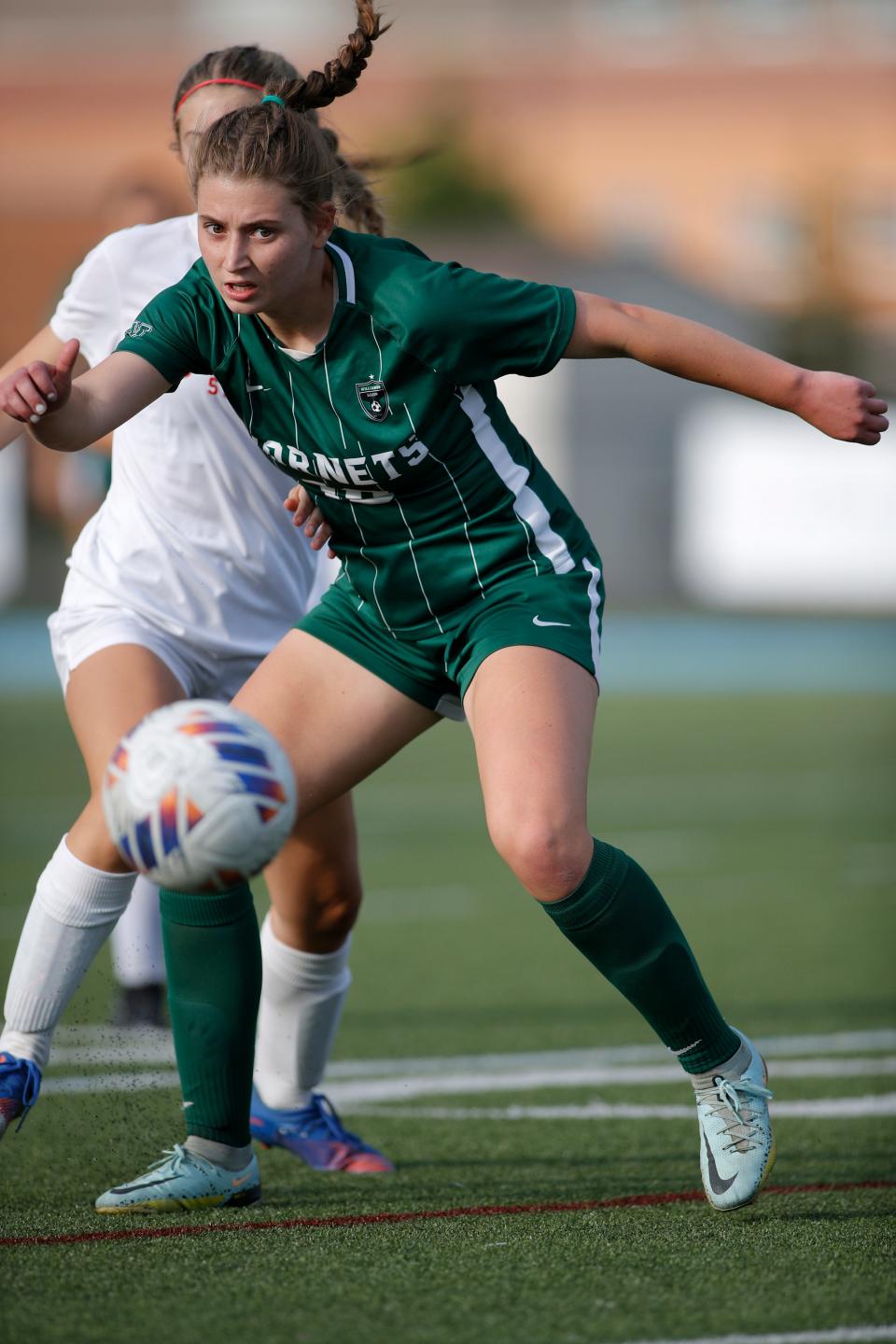 Williamston's Ashley Stover chases the ball against Grosse Ile, Thursday, June 8, 2023, at Lansing Catholic High School.