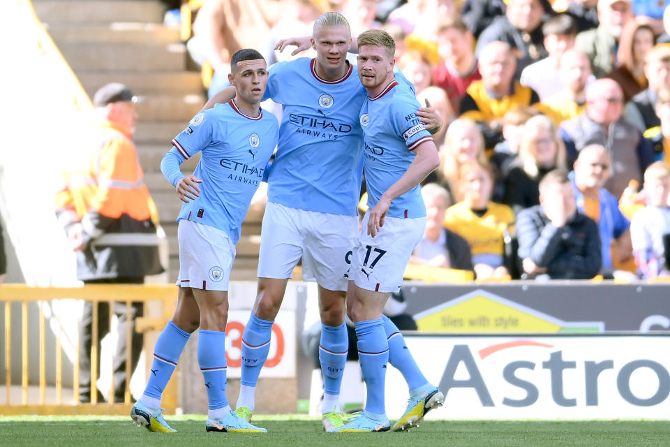 Erling Haaland (centre) celebrates with Manchester City teammates Phil Foden (left) and Kevin de Bruyne after scoring against Wolverhampton Wanderers. 