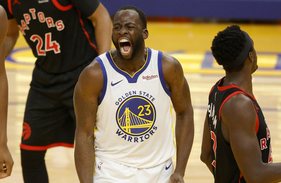 Draymond Green #23 of the Golden State Warriors reacts after he made a basket and was fouled during their game against the Toronto Raptors at Chase Center on January 10, 2021 in San Francisco, California. NOTE TO USER: User expressly acknowledges and agrees that, by downloading and or using this photograph, User is consenting to the terms and conditions of the Getty Images License Agreement.  (Photo by Ezra Shaw/Getty Images)