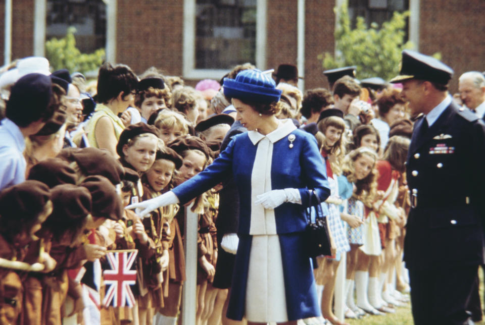 The Queen greets a group of brownies during her Silver Jubilee celebrations. (Getty)