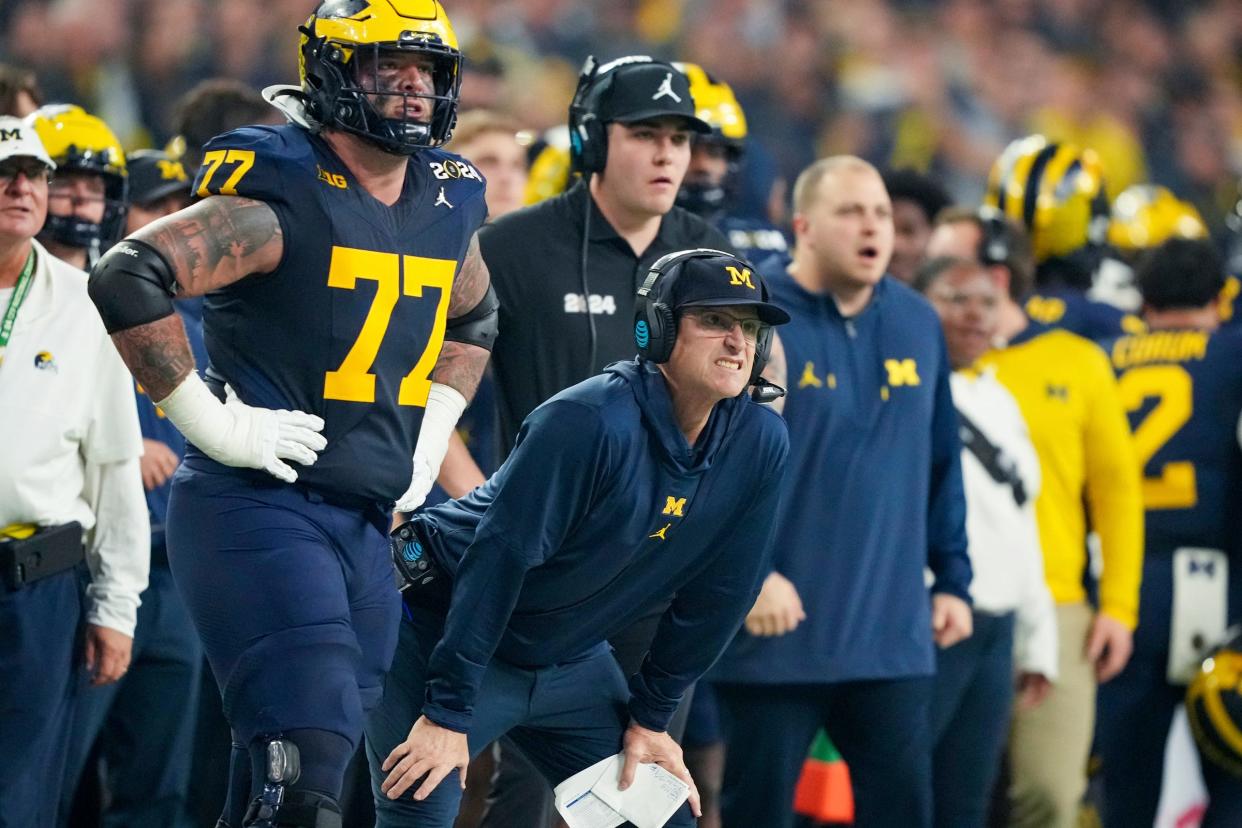 Michigan head coach Jim Harbaugh watches from the sideline in the second quarter during the College Football Playoff national championship game against Washington at NRG Stadium in Houston, Texas on Monday, Jan. 8, 2024.