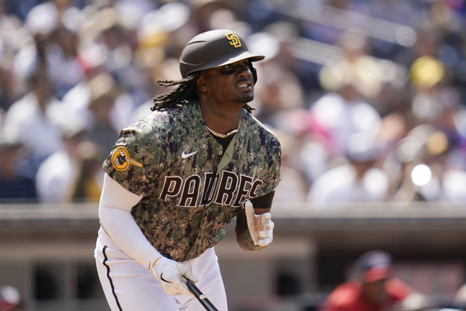 San Diego Padres' Josh Bell watches his two-run home run hit during the sixth inning of a baseball game against the Washington Nationals, Sunday, Aug. 21, 2022, in San Diego. (AP Photo/Gregory Bull)