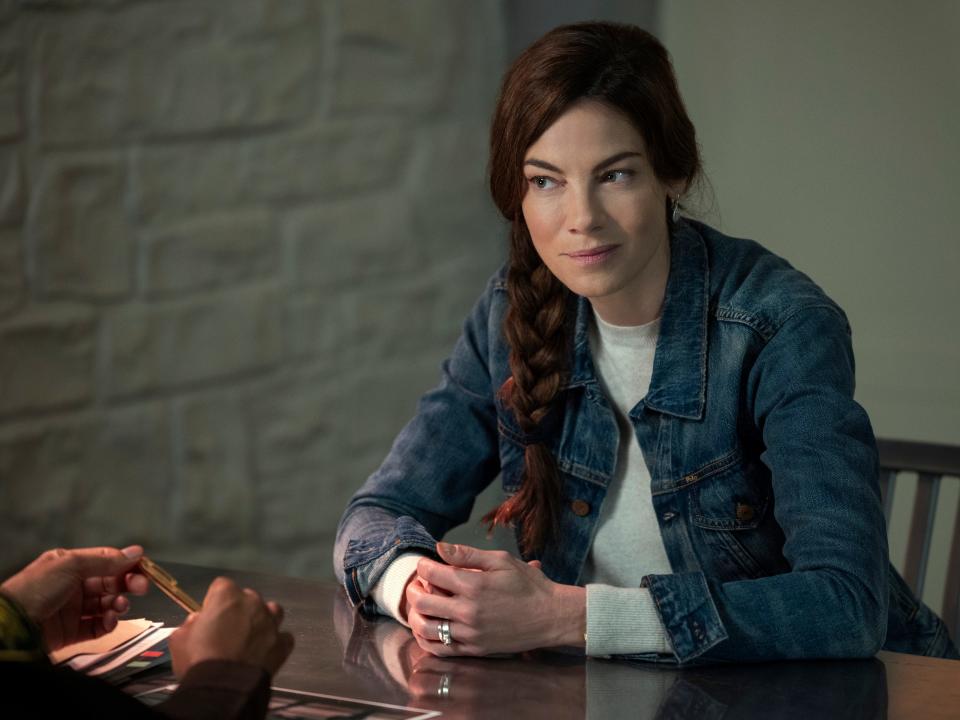 Michelle Monaghan on Echoes sitting at table with hands clasped