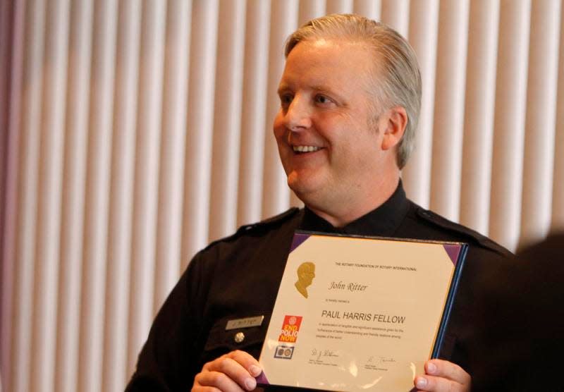 Greece Police Officer Jon Ritter after being honored by the Greece Rotary during a luncheon ceremony in February for his actions during the West Webster fire in December 2012.