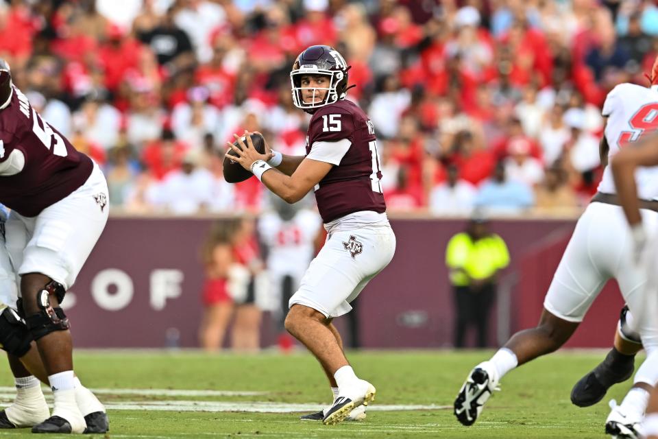 Sep 2, 2023; College Station, Texas; Texas A&M Aggies quarterback Conner Weigman (15) throws a pass during the first quarter against the New Mexico Lobos at Kyle Field. Maria Lysaker-USA TODAY Sports