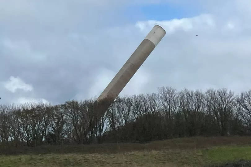 The historic 450ft Anglesey Aluminium chimney is toppled