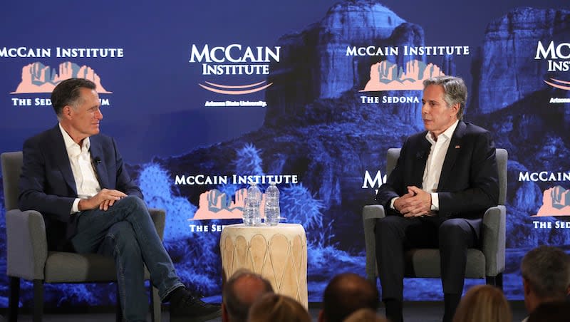 Utah Republican Sen. Mitt Romney, left, listens to U.S. Secretary of State Antony Blinken talk about his recent trip to the Middle East, at the McCain Institute's Sedona Forum in Sedona, Ariz., Friday, May 3, 2024.