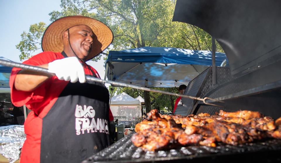 Frank Applingg barbecues chicken at Big Frank's Style BBQ's booth at the African American Arts and Culture Center's 14th annual Soul Food Festival at the Weber Point Events Center in downtown Stockton on Aug. 5, 2023.