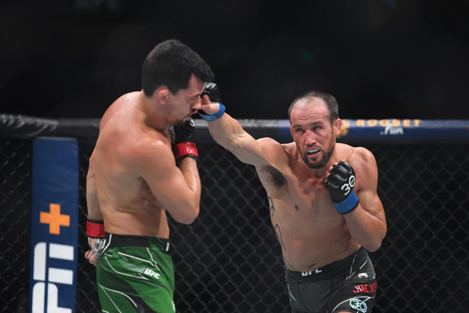 Aug 5, 2023; Nashville, Tennessee, USA; Billy Quarantillo (red gloves) fights Damon Jackson (blue gloves) during UFC Fight Night at Bridgestone Arena. Mandatory Credit: Christopher Hanewinckel-USA TODAY Sports