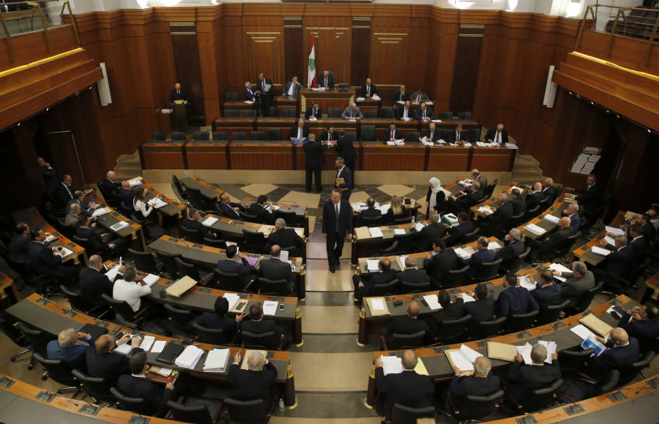 In this Tuesday, July 16, 2019 photo, Lebanese lawmakers and ministers meet at the parliament building during the opening session on the draft 2019 state budget, in Beirut, Lebanon, in Beirut, Lebanon. As the economic crisis deepens in Lebanon, so has the public’s distrust in the ability of the old political class, widely viewed as corrupt and steeped in personal rivalries, to tackle major reform. Many fear a Greek-style bankruptcy, without the European Union to fall back on, and with a potentially more violent social unrest in the small country wedged between war-torn Syria and Israel. (AP Photo/Hussein Malla)