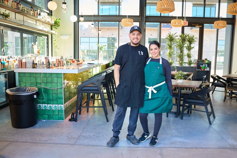 Feb 2, 2023; Tempe, AZ, United States; Husband and wife Armando Hernandez, left, and Nadia Holguin pose for a photo at Cocina Chiwas in Culdesac Tempe on Thursday. Feb. 2, 2023. Mandatory Credit: Alex Gould/The Republic