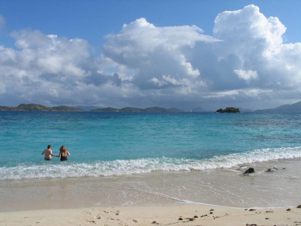 These beachgoers have Sapphire Beach, on St. Thomas, to themselves. In the distance are the British Virgin Islands. American Airlines is expanding service to the area from Charlotte.