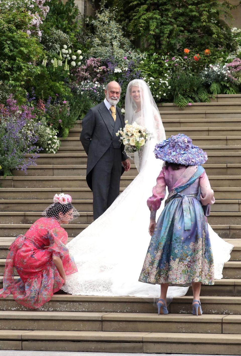 <p>Proud dad Prince Michael of Kent smiles with Lady Gabriella. Her dress was designed by Italian designer Luisa Beccaria.</p>