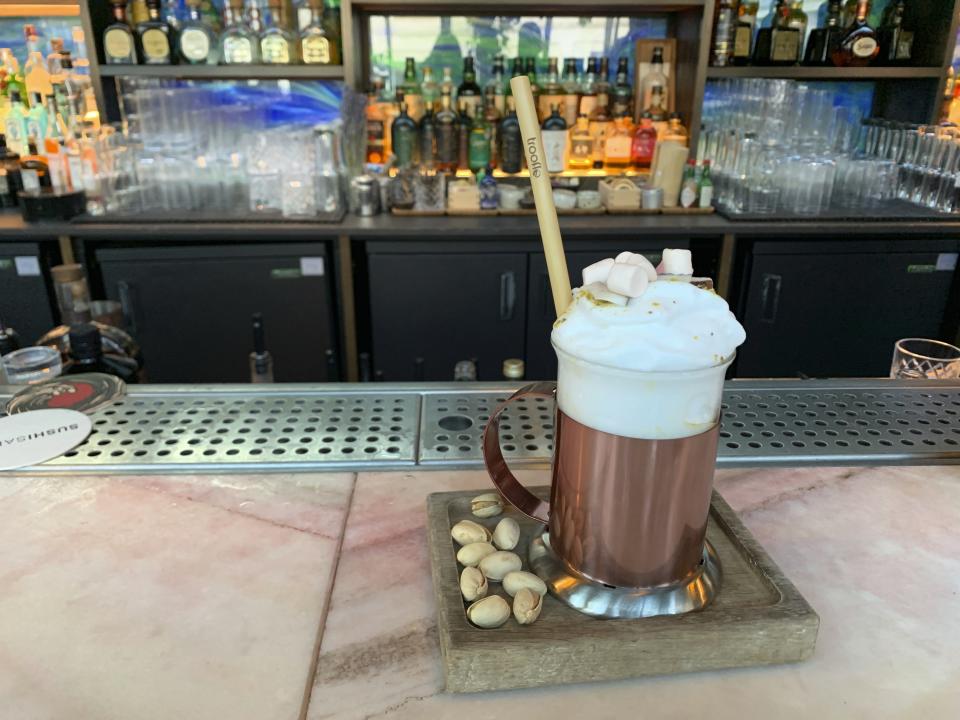 In this Wednesday, Dec, 4, 2019 photo, a snowplow espresso is displayed at Sushisamba, in Covent Garden in London. While mulled wine, warm spiced cider and hot toddies have long been British staples during winter many cocktail bars in London offer their own seasonal winter warmers. (AP Photo/Louise Dixon)